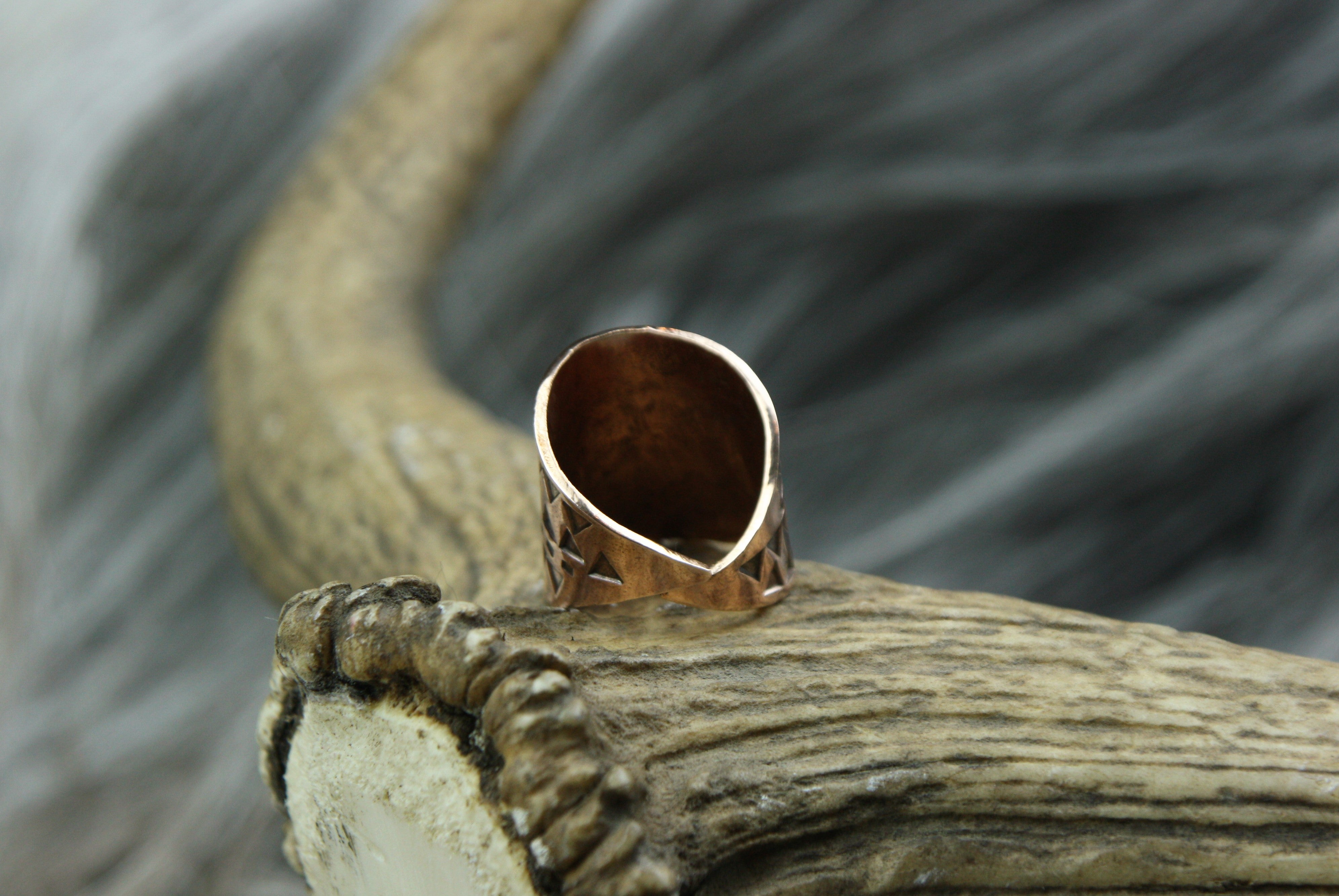 The back of a beautiful Bronze Hand Stamped Ring made in high copper alloy.