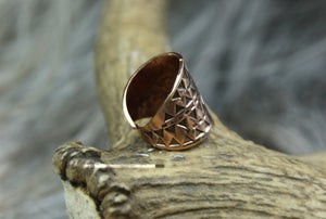 The side of a beautiful Bronze Hand Stamped Ring made in high copper alloy.