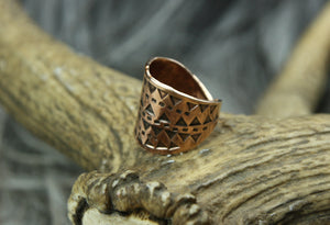 The front of a beautiful Bronze Hand Stamped Ring made in high copper alloy.